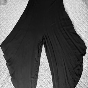 Black flowy jumpsuit/romper with side zipper.